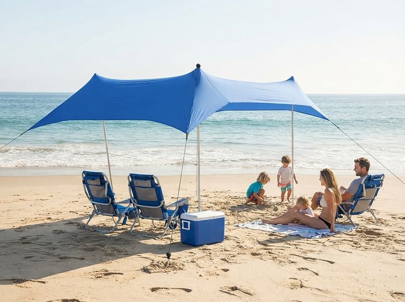 UMARDOO canopy standing over folding chairs at the end of a beach day