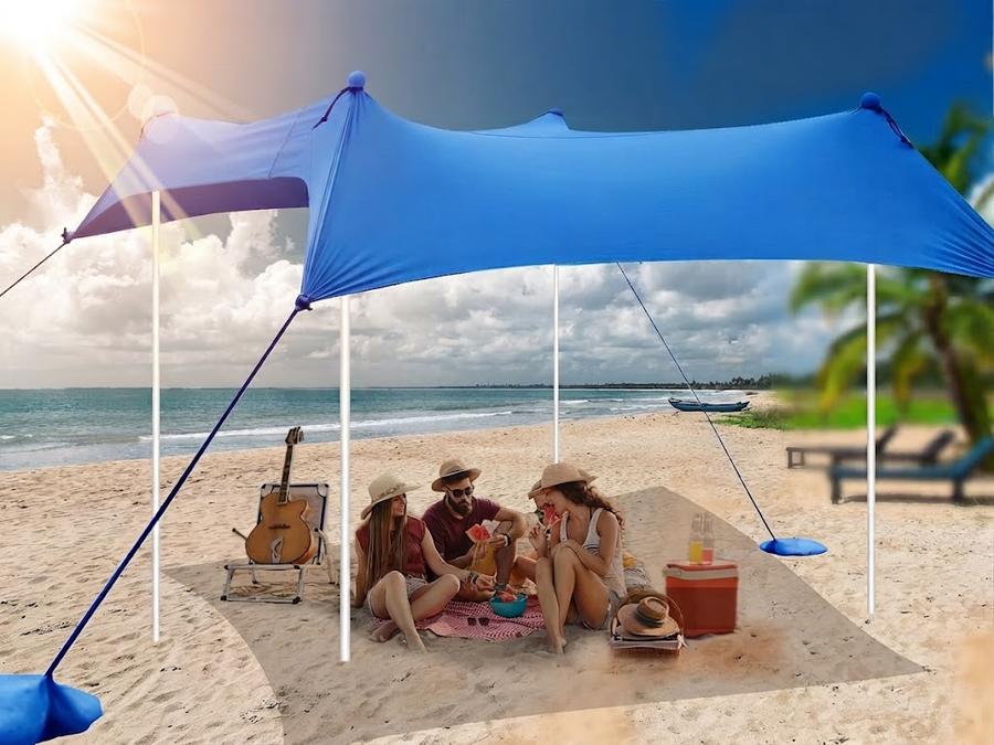 UMARDOO family beach canopy shading a group on open sand